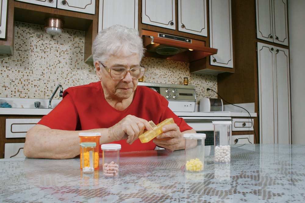 older woman taking plls.jpg
